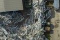 Beg pile of scrap aluminum metal siding from ruined houses after hurricane Ian swept through Florida. Recycle of broken Royalty Free Stock Photo