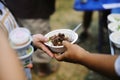 Beggar begs food from donors: concept of poverty in Asian society: Care concept : From the philanthropist to help Royalty Free Stock Photo