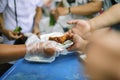 Beggar begs food from donors: concept of poverty in Asian society: Care concept : From the philanthropist to help Royalty Free Stock Photo