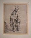 Beggar in a High Cap, Standing and Leaning on a Stick from 1630 by Rembrandt