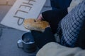 Beggar,Homeless adult man sitting on the street to get help. Indifference of people.