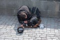 Beggar, homeless with Dog near Charles Bridge, Prague, Czech republic