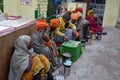 Beggar sitting in the way of badrinath temple