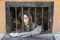 Beggar statue begging for money in the Prague old town street. Prague, Czech Republic, 18 May 2022 Royalty Free Stock Photo