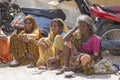 Beggars indian women waits for alms on a street in Pushkar, India