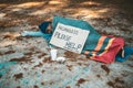 Beggars sleep on the street with homeless messages please help