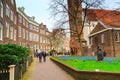 Begijnhof courtyard and people in Amsterdam, Netherlands