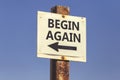 Begin again word and arrow signpost 2