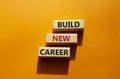 Begin new career symbol. Concept word Begin new career on wooden blocks. Beautiful orange background. Business and Begin new Royalty Free Stock Photo