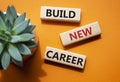 Begin new career symbol. Concept word Begin new career on wooden blocks. Beautiful orange background. Business and Begin new Royalty Free Stock Photo