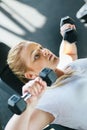 Beginner chubby girl exercising in fitness club Royalty Free Stock Photo