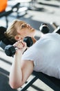 Beginner chubby girl exercising in fitness club Royalty Free Stock Photo