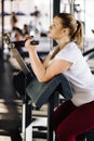 Beginner chubby girl exercising in fitness club Royalty Free Stock Photo