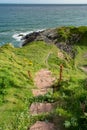 Beginning of Coastal Path from Collieston to Cruden Bay Path in Scotland. Royalty Free Stock Photo