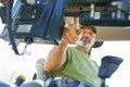 The beginning of the farming day. Shot of a farmer working inside the cab of a modern tractor. Royalty Free Stock Photo