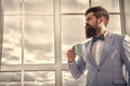 Beginning of great day. Important day in his life. Get ready. Enjoy every minute. Hipster in tuxedo with bow tie making Royalty Free Stock Photo