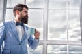 Beginning of great day. Important day in his life. Get ready. Enjoy every minute. Hipster in tuxedo with bow tie making Royalty Free Stock Photo