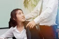 Beginning of love in office. Attractive young Asian woman feeling good with boyfreind in workplace