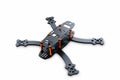 The beginning of the racing drone assembly. A robust frame of an unmanned aerial vehicle made of carbon fiber. Frame of carbon fib