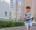 Beginning of the school year. Portrait of happy schoolgirl with books