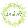 Beginning of spring pagan holiday. Imbolc inscription in a wreath of green leaves