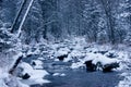 In the beginning of winter, the Ural river runs in a deep forest between snow-covered stones Royalty Free Stock Photo