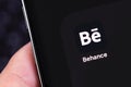 Behance mobile icon app on the screen smartphone in hand Royalty Free Stock Photo