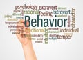 Behavior word cloud and hand with marker concept Royalty Free Stock Photo