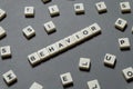 Behavior word made of square letter word on grey background.