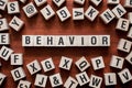 BEHAVIOR word written on wood block