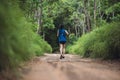 Behind active woman trail runner running in park outdoor Royalty Free Stock Photo