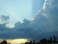 Behind this big cloud of rain and storm, the sun seems to want to return Royalty Free Stock Photo