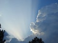 Behind this big cloud of rain and storm, the sun seems to want to return Royalty Free Stock Photo