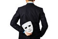 Behind of business man holding white mask. Royalty Free Stock Photo