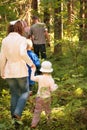 Behind Family in forest to mushrooms Royalty Free Stock Photo