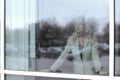 From behind the glass. young business woman looking out the office window Royalty Free Stock Photo