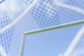 Behind the ropes of the outdoor soccer field goal net, the football goal background Royalty Free Stock Photo