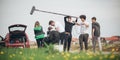 Behind the scene. Film crew filming movie scene outdoor Royalty Free Stock Photo