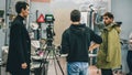 Behind the scene. Film crew filming movie scene in studio Royalty Free Stock Photo