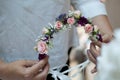 Girl Making a Beautiful Wedding Flower Crown with Pink Roses Royalty Free Stock Photo