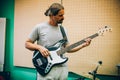 Behind scene. Guitarist practice playing guitar in messy music s Royalty Free Stock Photo