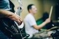 Behind scene. Rock band practice in messy recording music studio Royalty Free Stock Photo