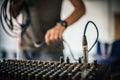 Behind the scene. Sound technician electric engineer adjusting sound elements Royalty Free Stock Photo