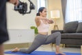 Behind the scenes of Fit young woman doing yoga and meditation at home, sport and healthy lifestyle concept Royalty Free Stock Photo