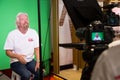 Behind the Scenes Interview with Ricard Branson on a green screen video tv recording set in a Virgin Mobile store