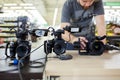 Behind the scenes of movie shooting or video production and film crew team with camera equipment at outdoor location. Royalty Free Stock Photo