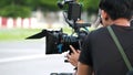 Behind the scenes of movie shooting or video production.