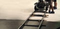 Behind the scenes of production team setting dolly track. Royalty Free Stock Photo