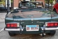 Behind shot of an old green sports car in Downers Grove, United States