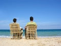 Behind sitting couple on beach 2 Royalty Free Stock Photo